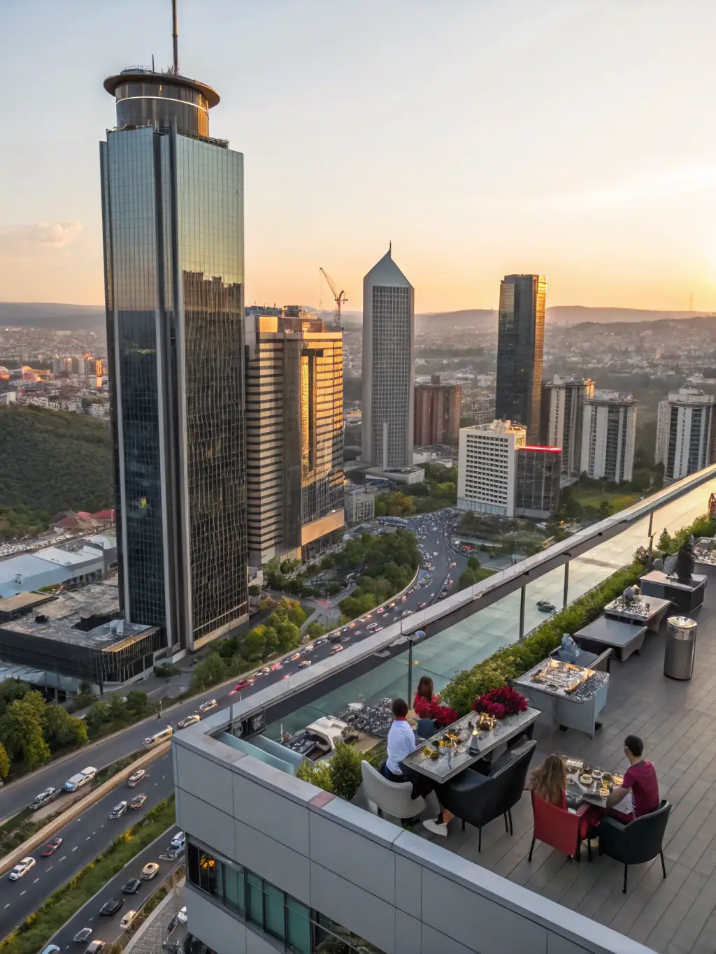 A modern and stylish hotel in Istanbul, Turkey, showcasing its elegant architecture, a rooftop terrace with panoramic city views, and guests relaxing by the pool.