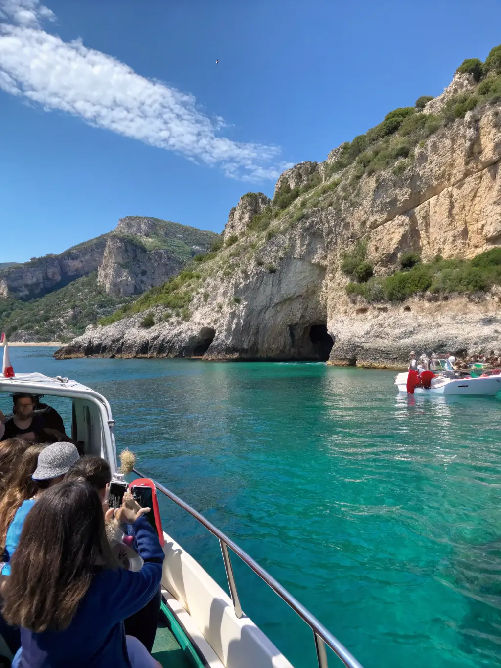 A scenic image of a boat excursion along the Turkish Riviera, featuring crystal-clear waters and stunning coastal scenery.
