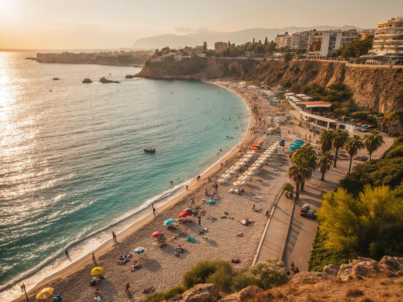 A picturesque aerial view of Antalya, Turkey, showcasing its beautiful beaches, clear turquoise waters, and luxury resorts along the coastline.