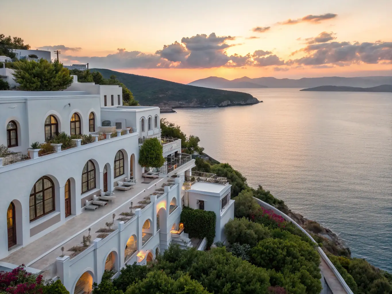 A luxurious beachfront hotel in Antalya, Turkey, featuring a stunning view of the Mediterranean Sea and a private beach.